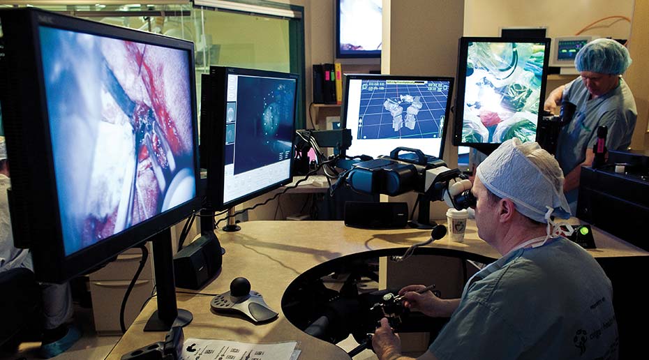 A surgeon controlling a robotic arm to perform a neurosurgery.