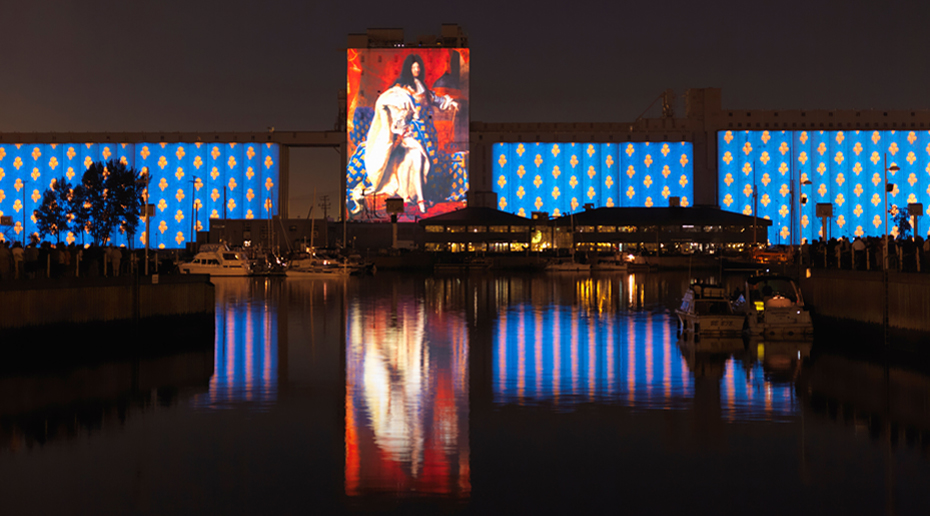 A view of a projection of King Louis XIV from Quebec City's harbour.