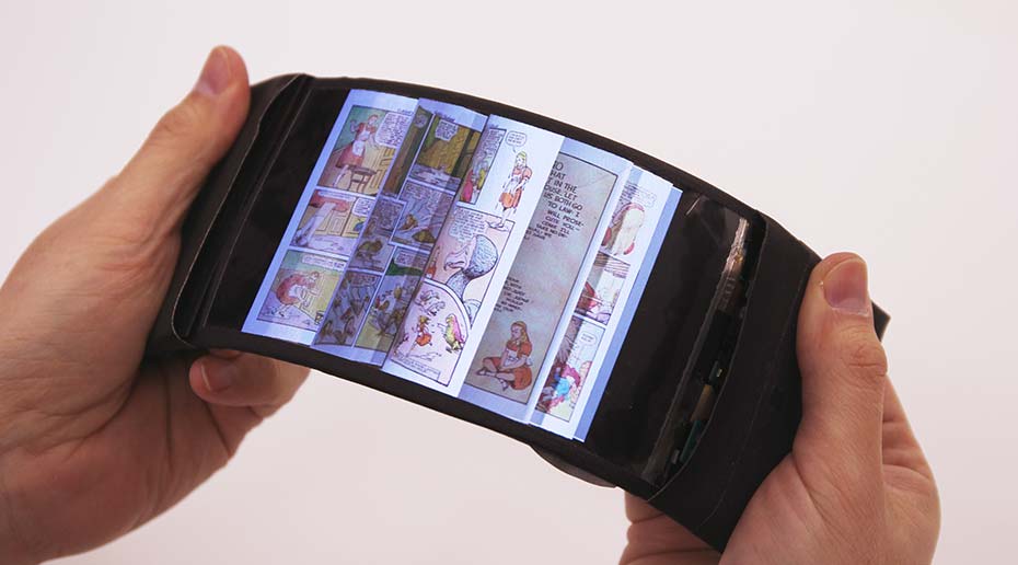 A pair of hands holding and bending a flexible smartphone.
