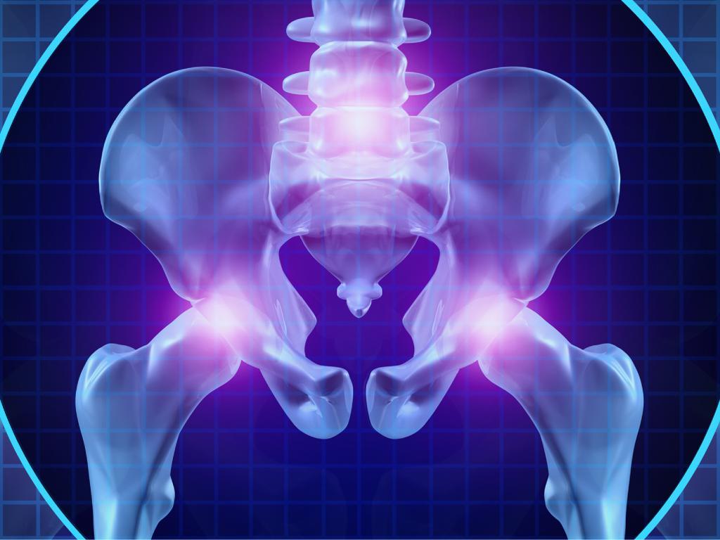 Graphique d’un os de hanche humain, les articulations sont éclairées par des lumières violettes.